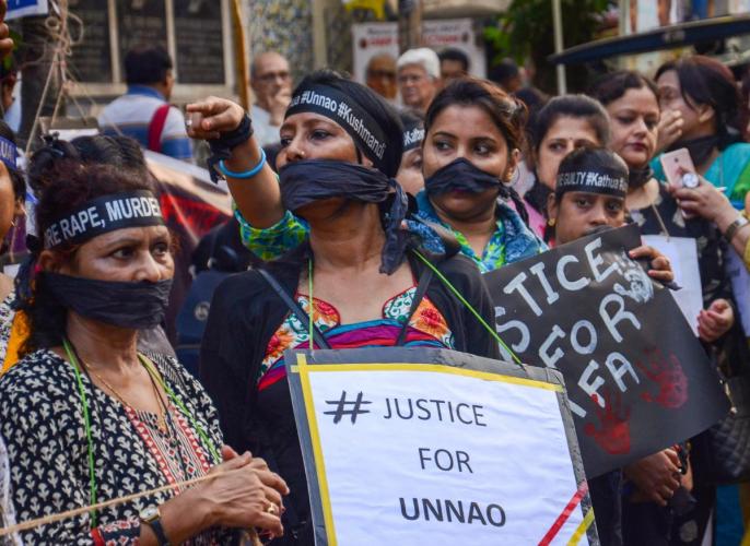 Girl students and women take part in a protest demonstration 