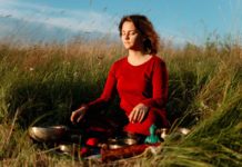 Both Ayurveda As Well As Allopathy Are Needed In A Country Like India Woman Sitting in a field