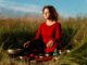 Both Ayurveda As Well As Allopathy Are Needed In A Country Like India Woman Sitting in a field
