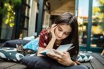 List Of Must Read Books That No Book Lover Can Afford Missing Out | N4M Review Young Book Lover Enjoying a Must Read Book