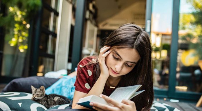 List Of Must Read Books That No Book Lover Can Afford Missing Out | N4M Review Young Book Lover Enjoying a Must Read Book