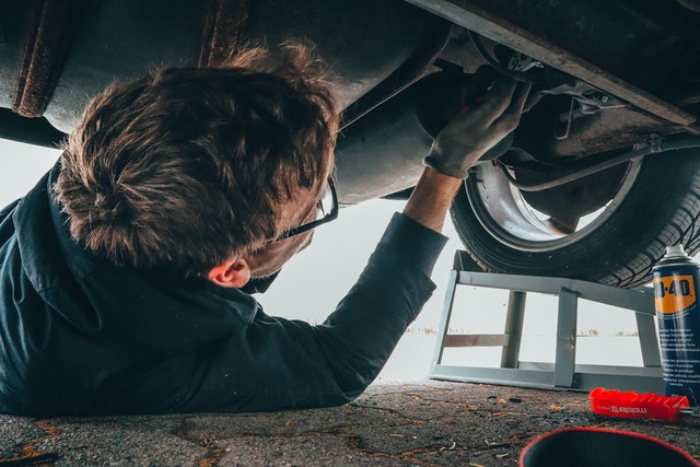 Man fixing car engine