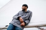 The Ideal Fashion Statement: How To Pair Beanie With Denim To Get The Stylish Look Man posing stylishly