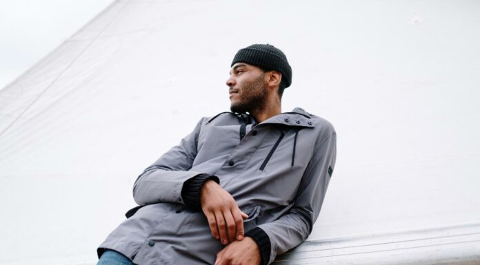 The Ideal Fashion Statement: How To Pair Beanie With Denim To Get The Stylish Look Man posing stylishly