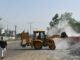 ‘Making Ends Meet’ More Important For Indian Workers Than Worry About Toxic Air Risks Driver Picks Up Gravel
