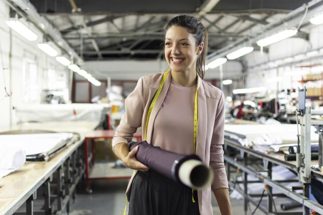 Smiling woman manufacturing business