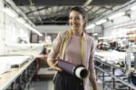 5 Essential Services For Your Manufacturing Business Smiling woman manufacturing business