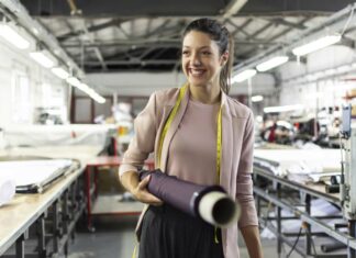 5 Essential Services For Your Manufacturing Business Smiling woman manufacturing business