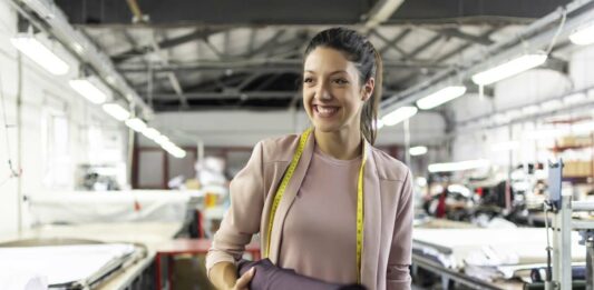 5 Essential Services For Your Manufacturing Business Smiling woman manufacturing business
