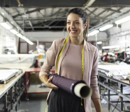 5 Essential Services For Your Manufacturing Business Smiling woman manufacturing business
