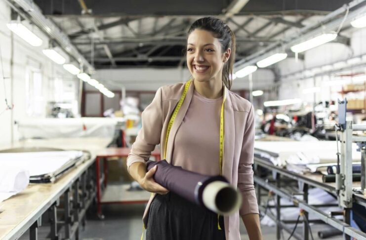 Smiling woman manufacturing business