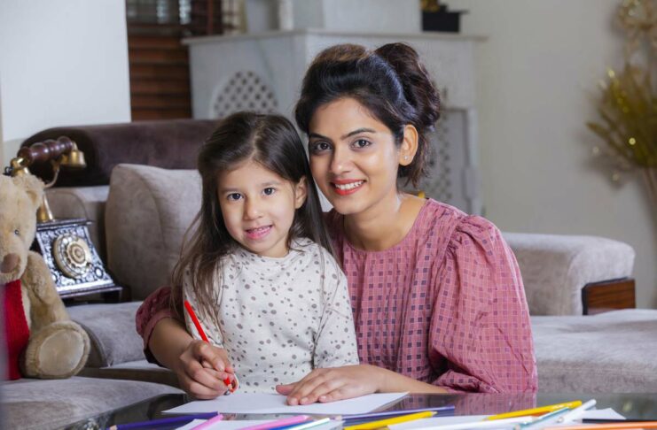 Mother teaching essential skills to child